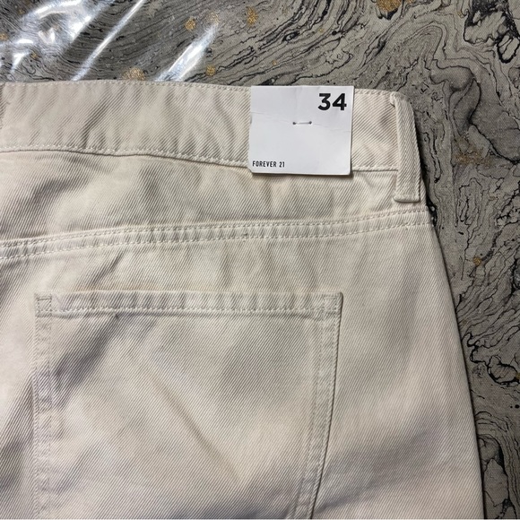 Mid-Rise Raw-Cut Denim Shorts
Size 34
Color is light beige
Brand is Forever 21 - Picture 5 of 6